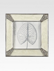 Masterful enameling has the look of lustrous mother-of-pearl in this elegant square frame with Swarovski crystals shimmering at each corner.Enamel and crystalWhite bronze finishHandmade, hand-enameled and hand-set2.75 square; holds a 2 square photoImported