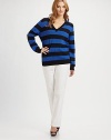 A classic silhouette with a bold striped pattern and sequin-adorned elbow patches for a uniquely charming look.V-neckLong sleevesRib-knit trimPull-on style52% cotton/45% polyester/3% angoraHand washImported