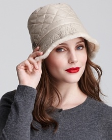 Quilting lends classic style to this plush, shearling-trimmed bucket hat from UGG® Australia.