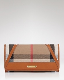 Keep your cash (and card) cache organized with Burberry's check wallet. Take the plaid package into after hours--it doubles as a preppy chic clutch with a black sheath and kitten heels. Keep your cash (and card) cache organized with Burberry's check wallet. Take the plaid package into after hours--it doubles as a preppy chic clutch with a black sheath and kitten heels.