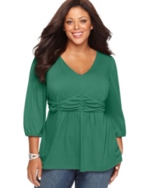 A feminine silhouette highlights NY Collection's three-quarter sleeve plus size top, accentuated by a ruched empire waist-- snag all the colors at an Everyday Value!