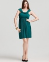 An elegantly draped neckline and flattering empire waist lend date-night status to this Rachel Pally White Label dress.