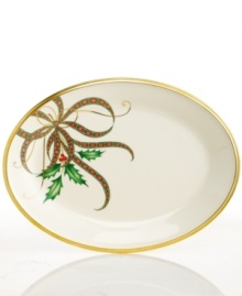 A mixture of Lenox's Holiday holly motif and their classic Christmas plaid ribbon creates an elegant design upon this wide oval serving platter from the holiday dinnerware and dishes collection. Scrolling accents and a rim of 24-karat gold finish the look with lasting grace. A mixture of Lenox's Holiday holly motif and their classic Christmas plaid ribbon creates an elegant design upon this wide oval serving platter from the holiday dinnerware and dishes collection. Scrolling accents and a rim of 24-karat gold finish the look with lasting grace.
