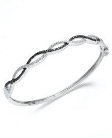 Standout sparkle. Victoria Townsend's sweetly contrasting bangle bracelet combines both round-cut black diamonds (1/5 ct. t.w.) and white diamond accents. Set in sterling silver. Approximate length: 7-1/4 inches. Standout sparkle. Victoria Townsend's sweetly contrasting bangle bracelet combines both round-cut black diamonds (1/5 ct. t.w.) and white diamond accents. Set in sterling silver. Approximate length: 7-1/4 inches.