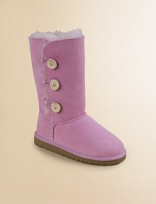Twin-faced sheepskin will keep cute little feet naturally warm updated with a wooden button and loop closure for easy on and off.Twin-face sheepskin upper Logo button and loop closure Molded EVA sole Suede heel guards Woven label on heel Imported Twin-faced sheepskin will keep cute little feet naturally warm updated with a wooden button and loop closure for easy on and off.Twin-face sheepskin upper Logo button and loop closure Molded EVA sole Suede heel guards Woven label on heel Imported