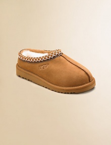 Both a shoe and slipper, this ultra-cozy, ultra-comfy style has slipper-like styling plus a sturdy sole for outdoor wear. Suede upper Sheepskin lining Heritage Tasman braid collar edging Clasic EVA outsole Imported Both a shoe and slipper, this ultra-cozy, ultra-comfy style has slipper-like styling plus a sturdy sole for outdoor wear. Suede upper Sheepskin lining Heritage Tasman braid collar edging Clasic EVA outsole Imported