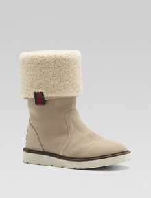 Sporty suede boots, cuffed and lined in curly, cozy shearling fleece.Suede upper Shearling cuff and lining Rubber sole Made in Italy Sporty suede boots, cuffed and lined in curly, cozy shearling fleece.Suede upper Shearling cuff and lining Rubber sole Made in Italy
