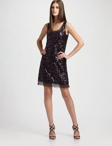 This all-over sequin style dazzles with a touch of delicate organza trim. Sleeveless Organza trimmed u-neck Fully lined Organza trimmed hem About 19 from natural waist Polyester Dry clean Imported This all-over sequin style dazzles with a touch of delicate organza trim. Sleeveless Organza trimmed u-neck Fully lined Organza trimmed hem About 19 from natural waist Polyester Dry clean Imported