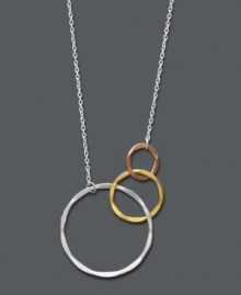 The perfect pendant to perfect a variety of looks. Studio Silver's versatile design combines three metallics in one! Graduated, interlocking rings shine in sterling silver, 18k rose gold over sterling silver, and 18k gold over sterling silver. Approximate length: 16 inches. Approximate drop: 1/2 inch.