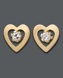 Simply sweet. Polished 14k gold hearts frame gleaming cubic zirconia accents in these stud earrings for a special little girl.