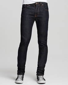 Skinny, slim cut jeans that are tight to the leg. A sleek look with Nudie's signature orange stitching and back pocket embroidery. Five pocket dry denim. Button fly. Skinny, slim cut jeans that are tight to the leg. A sleek look with Nudie's signature orange stitching and back pocket embroidery. Five pocket dry denim. Button fly.