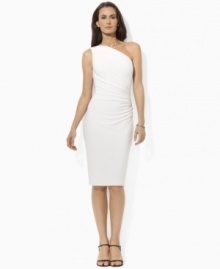 Exuding modern elegance in a one-shoulder silhouette, this glamorous Lauren by Ralph Lauren dress is rendered in slinky matte jersey with delicate ruching and a dazzling crystal-studded embellishment.