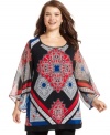 Electrify your leggings with Style&co.'s three-quarter-sleeve plus size tunic top, broadcasting a bold print.