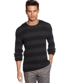 Bold horizontal stripe sweater by Calvin Klein with silhouettes of multi-circles on each stripe makes it a style standout.