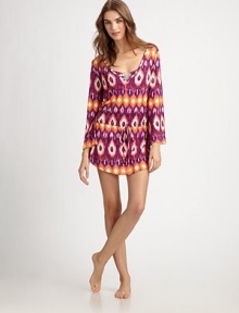 When colors collide, a vibrant and flattering coverup is created. V-neckThree-quarter sleevesDropped, drawstring waistCurved hem95% rayon/5% spandexHand washMade in USA of Italian fabric When colors collide, a vibrant and flattering coverup is created. V-neckThree-quarter sleevesDropped, drawstring waistCurved hem95% rayon/5% spandexHand washMade in USA of Italian fabric