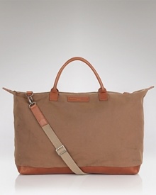 Crafted in organic cotton with leather accents, this handsome weekender bag is perfect for packing the essentials, keeping your trip simple and stylish. Crafted in organic cotton with leather accents, this handsome weekender bag is perfect for packing the essentials, keeping your trip simple and stylish.