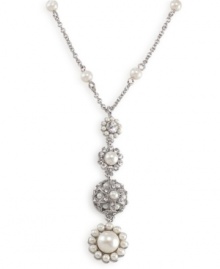 Layer on old-world elegance with this romantic necklace by Carolee. Dramatic pendant features crystal, glass pearl and intricate bejeweled medallion. Crafted in imitation rhodium-plated mixed metal. Approximate length: 16 inches + 2-inch extender. Approximate drop: 2-1/4 inches.