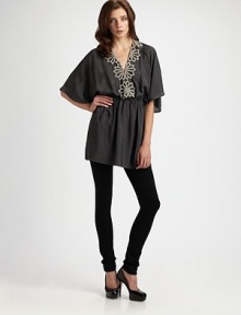 A woven blouson silhouette, hand-beaded for sophisticated charm.V necklineDropped shouldersFlutter sleevesElastic waistbandAbout 32 from shoulder to hemViscoseDry cleanImportedModel shown is 5'9 (175cm) wearing US size Small. A woven blouson silhouette, hand-beaded for sophisticated charm.V necklineDropped shouldersFlutter sleevesElastic waistbandAbout 32 from shoulder to hemViscoseDry cleanImportedModel shown is 5'9 (175cm) wearing US size Small.