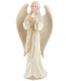 An ethereal angel in porcelain, this lovely figurine brings good tidings to your home with an aura of peace and kindness. From Lenox.