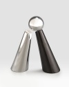 Elegantly evoking the southwest's rugged natural elements, the gleaming metal saltshaker leans into its black granite peppermill cousin. Tarnish-resistant metal Hand wash Salt shaker: 6½H X 2¾ diam. Peppermill: 7H X 2¾ diam. Imported 