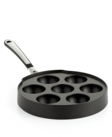 Simply slip into the flavorful filled goodness of a timeless treat. Everyone's favorite breakfast fare gets even tastier with irresistible fillings that greet your sweet tooth with just what it craves. Crafted from medium-gauge hard-anodized aluminum, the Ebelskiver pan requires little to no use of oil and provides an even heating that produces golden, brown puff pancakes every time. 10-year warranty. Simply slip into the flavorful filled goodness of a timeless treat. Everyone's favorite breakfast fare gets even tastier with irresistible fillings that greet your sweet tooth with just what it craves. Crafted from medium-gauge hard-anodized aluminum, the Ebelskiver pan requires little to no use of oil and provides an even heating that produces golden, brown puff pancakes every time. 10-year warranty.
