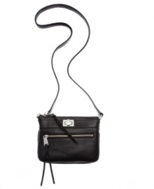 Simplistically chic with just enough shine. This luxurious leather crossbody from Calvin Klein gives you on-the-go style with glistening hardware and conveniently placed pockets. Simplistically chic with just enough shine. This luxurious leather crossbody from Calvin Klein gives you on-the-go style with glistening hardware and conveniently placed pockets.