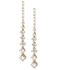 Glistening and glamorous. These linear earrings from Betsey Johnson are crafted from gold-tone mixed metal with faceted crystals providing a radiant look. Approximate drop: 2-1/2 inches. Glistening and glamorous. These linear earrings from Betsey Johnson are crafted from gold-tone mixed metal with faceted crystals providing a radiant look. Approximate drop: 2-1/2 inches.