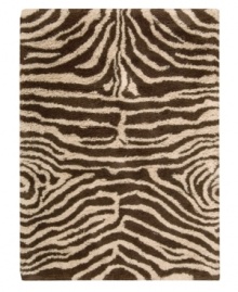 Exotic designs will be the pride of your decor. Adorned with zebra stripes in ivory and brown, this Nourison rug has a marvelously soft and shaggy pile that's hand-tufted from premium-quality yarns. Beautiful in appearance and plush underfoot, this area rug creates an atmosphere of casual elegance. (Clearance) Exotic designs will be the pride of your decor. Adorned with zebra stripes in ivory and brown, this Nourison rug has a marvelously soft and shaggy pile that's hand-tufted from premium-quality yarns. Beautiful in appearance and plush underfoot, this area rug creates an atmosphere of casual elegance. (Clearance)