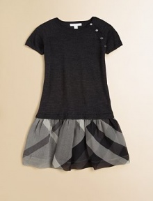 Crafted in cozy, toasty wool in a drop-waist silhouette with classic checks and shoulder button detail.CrewneckShort sleevesPullover styleDrop-waistWoolDry cleanImported