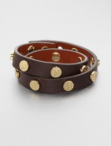This coated saffiano leather design features a row of logo studs. Coated saffiano leatherGoldtoneLength, about 15.75Snap button closureImported This coated saffiano leather design features a row of logo studs. Coated saffiano leatherGoldtoneLength, about 15.75Snap button closureImported