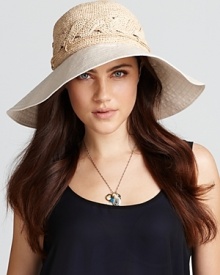 A stylish sun hat accented by intricately woven raffia and lightweight canvas. The perfect packable accessory for your next holiday.