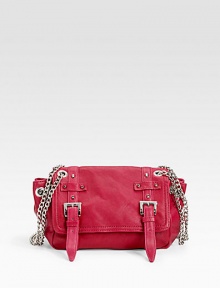 Chic and compact leather must-have detailed with cone studs, silvery buckles, oversized grommets and chains for a dash of downtown style.Double crossbody chains, 21 drop Magnetic snap flap closure Protective metal feet One inside zip pocket Fully lined 12W X 8H X 3½D Imported