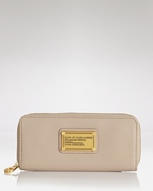MARC BY MARC JACOBS' zip around leather wallet is a practical accessory with a playful side. In a punched up hue, this wallet is almost too chic to hide in your purse. MARC BY MARC JACOBS' zip around leather wallet is a practical accessory with a playful side. In a punched up hue, this wallet is almost too chic to hide in your purse.