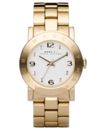 Go for all that glitters. This ultra-cool Marc by Marc Jacobs watch features a goldtone ion-plated stainless steel bracelet and round case. Logo etched at bezel. White dial with logo, goldtone numerals and crystal accents at markers. Quartz movement. Water resistant to 30 meters. Two-year limited warranty.