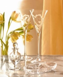 Ideal for gift giving, these flutes are an expression of your most heartfelt sentiments. Swirls of frosted crystal and slender, lengthened stems create a uniquely elegant design. Shown back. Ideal for gift giving, these flutes are an expression of your most heartfelt sentiments. Swirls of frosted crystal and slender, lengthened stems create a uniquely elegant design. Shown back.