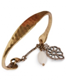 Southwestern chic. Lucky Brand's cuff bracelet, crafted from gold-tone mixed metal, has semi-precious rock crystal and glass mother of pearl charms dangling for a dazzling effect. Approximate diameter: 2-5/8 inches.