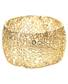 Crazy for cuffs? You're gonna love Jones New York's gemetrically-chic design. Asymmetrical ovals and circles combine with a sporadic dusting of round-cut crystals. Crafted in gold-plated mixed metal with a slip-on hinge clasp. Approximate diameter: 2-1/2 inches.