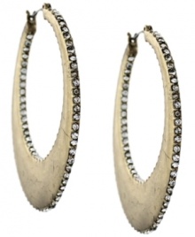 Shine from the inside out! Delicate, round-cut pave glass adorn both the inside and outside of these glam hoop earrings by Jessica Simpson. Crafted in gold tone mixed metal. Approximate drop: 2 inches. Approximate diameter: 1-1/4 inches.