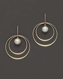 Beautiful textures in 14 Kt. yellow gold. A double hoop earring with fresh water pearl center.