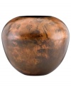 Finished by fire, each Burnished Copper vase is an individual. Rich earth tones and a unique mottled design distinguish the sculptural vessel for modern settings. By Donna Karan Lenox.