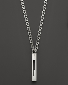 A sterling silver chain bears a Gucci logo pendant.