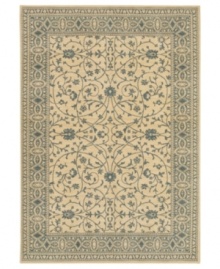 Cool and cordial, this sweet Karastan area rug welcomes you to the most comfortable spot in your home. A soft beige ground is trimmed with lane-blue patterns in a pleasing design inspired by antique English manor house rugs. Wool construction with cotton foundation for added strength and softness.