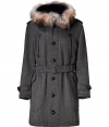 An ultra luxe investment packet with exquisite details, Burberry Londons fur and shearling trimmed coat is a chic choice, guaranteed for multi-season sophistication - Black shearling lined stand-up collar with side toggle closure, raccoon fur trimmed drawstring hood, long sleeves, belted cuffs, epaulettes, hidden zipper and button-down front, buttoned flap pockets, black leather trimmed slit pockets, belted waistline, belt loops, quilted lining - Tailored fit, 3/4 length - Team with luxe cashmere accessories and sleek leather boots