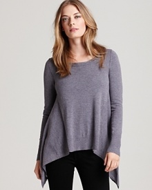 A new season update for your staple collection, this asymmetric Laurie B. sweater boasts draped side panels for a forward weekend. Rock the piece with dark wash skinnies and trend-right ankle booties for downtown cool.