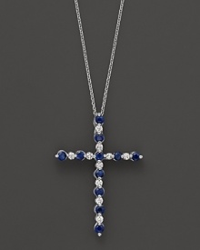 Diamonds and sapphires in a 14K white gold cross pendant on a fine chain.