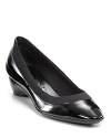 A sleek patent leather pump with a part heel and part wedge for a modern look.