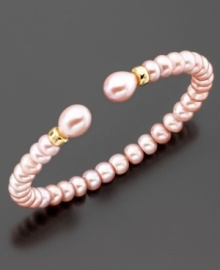 The perfect romantic accent to your lovely look; this bracelet features beautiful pink cultured freshwater pearls (6-9 mm) set in 14k gold. Approximate diameter: 2 inches. Approximate length: 7 inches. The perfect romantic accent to your lovely look; this bracelet features beautiful pink cultured freshwater pearls (6-9 mm) set in 14k gold. Approximate diameter: 2 inches. Approximate length: 7 inches.