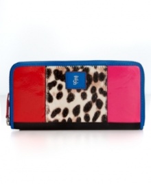 Opt for an exotic vibe with this zip wallet from Juicy Couture. The organized interior is packed with pockets and compartments, while the outside flaunts bold spots and cool colorblock detailing for a look that's undecidedly eye-catching.