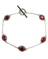 Vibrant in vermilion. A resplendent red hue stands out on this beautiful toggle link bracelet from Judith Jack. Embellished with marcasite and synthetic corundum (3-1/5 ct. t.w.), it's set in sterling silver. Approximate length: 7-1/4 inches.