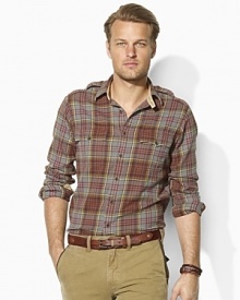 Ideal as a layering piece or perfectly rugged on its own, this trim-fitting military shirt is rendered from supremely soft flannel in a classic plaid print. Ideal as a layering piece or perfectly rugged on its own, this trim-fitting military shirt is rendered from supremely soft flannel in a classic plaid print.